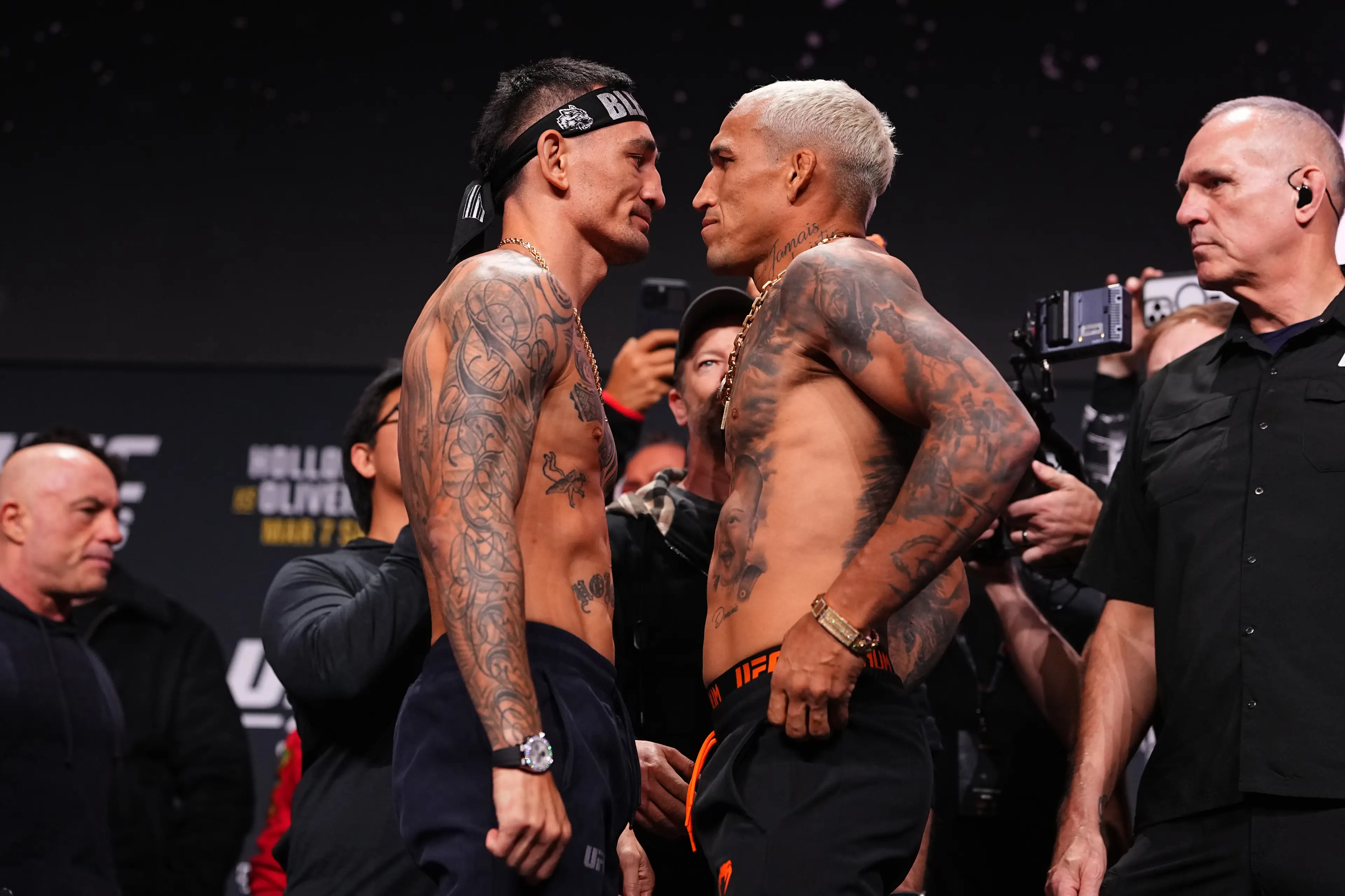 Max Holloway and Charles Oliveira face-off ahead of their BMF fight at UFC 326. Image: Getty 
