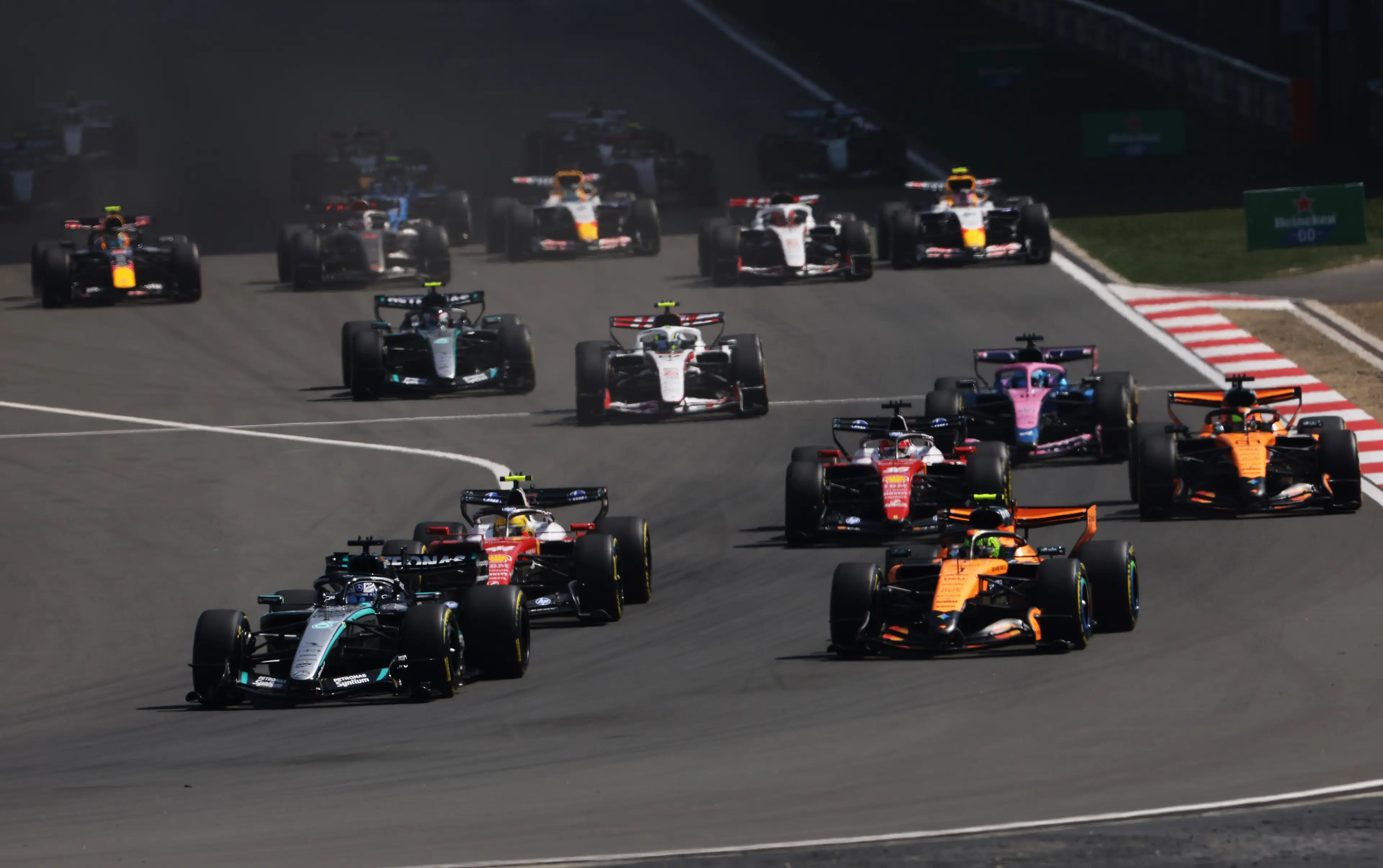 George Russell of Great Britain driving the (63) Mercedes AMG Petronas F1 Team W17 leads Lando Norris of Great Britain driving the (1) McLaren MCL40 Mercedes Lewis Hamilton of Great Britain driving the (44) Scuderia Ferrari SF-26 (Getty Images)