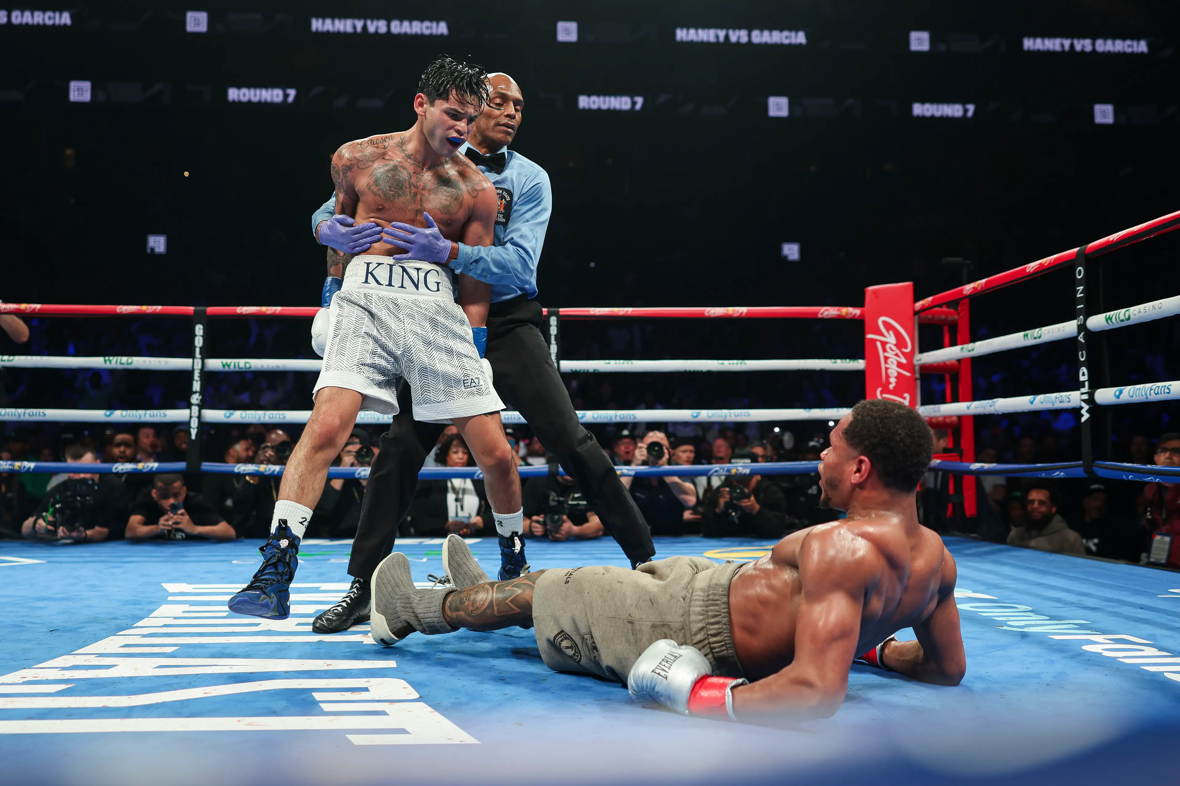 Ryan Garcia stands over Devin Haney after dropping him. Image: Getty