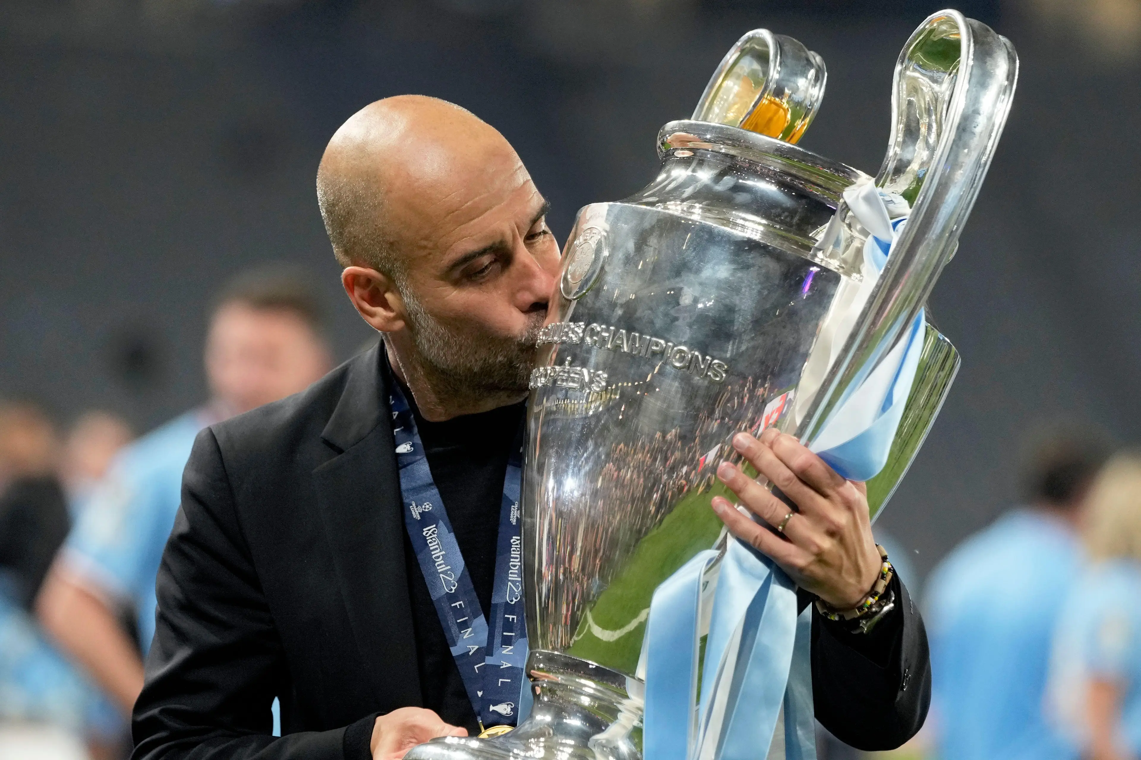 Pep Guardiola plants a kiss on the Champions League trophy. Image: Alamy 