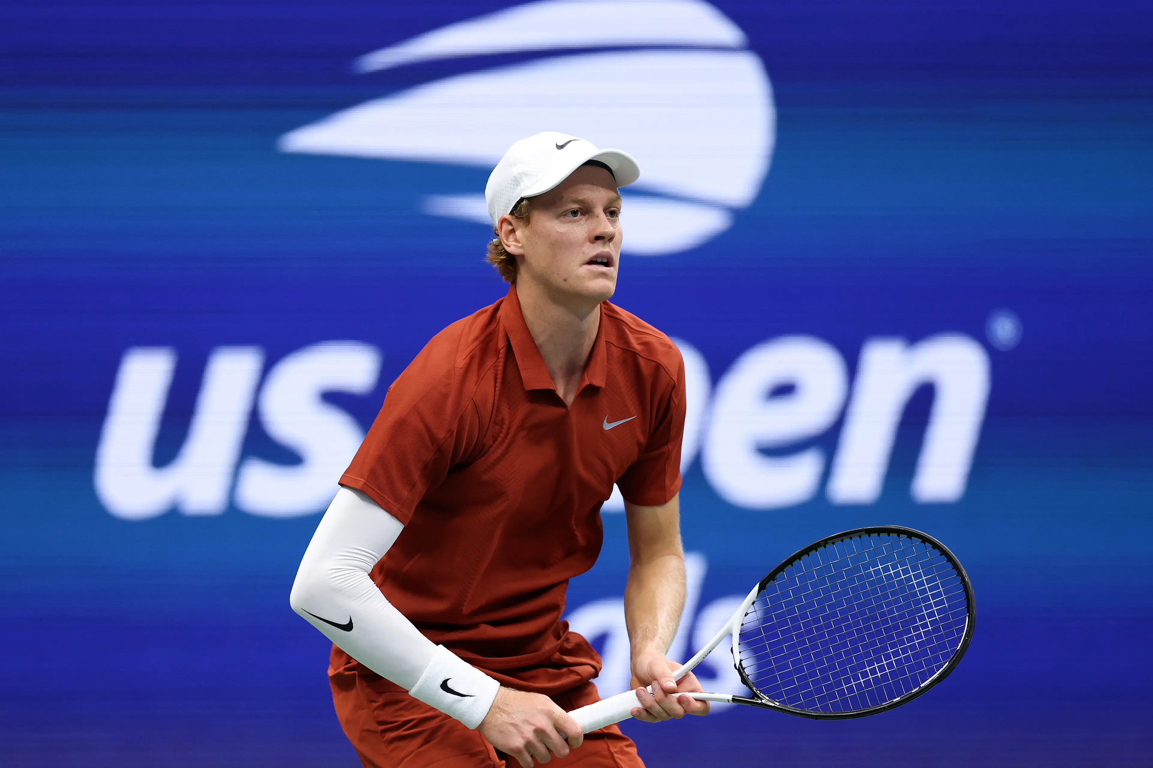 Jannik Sinner of Italy prepares to return against Carlos Alcaraz