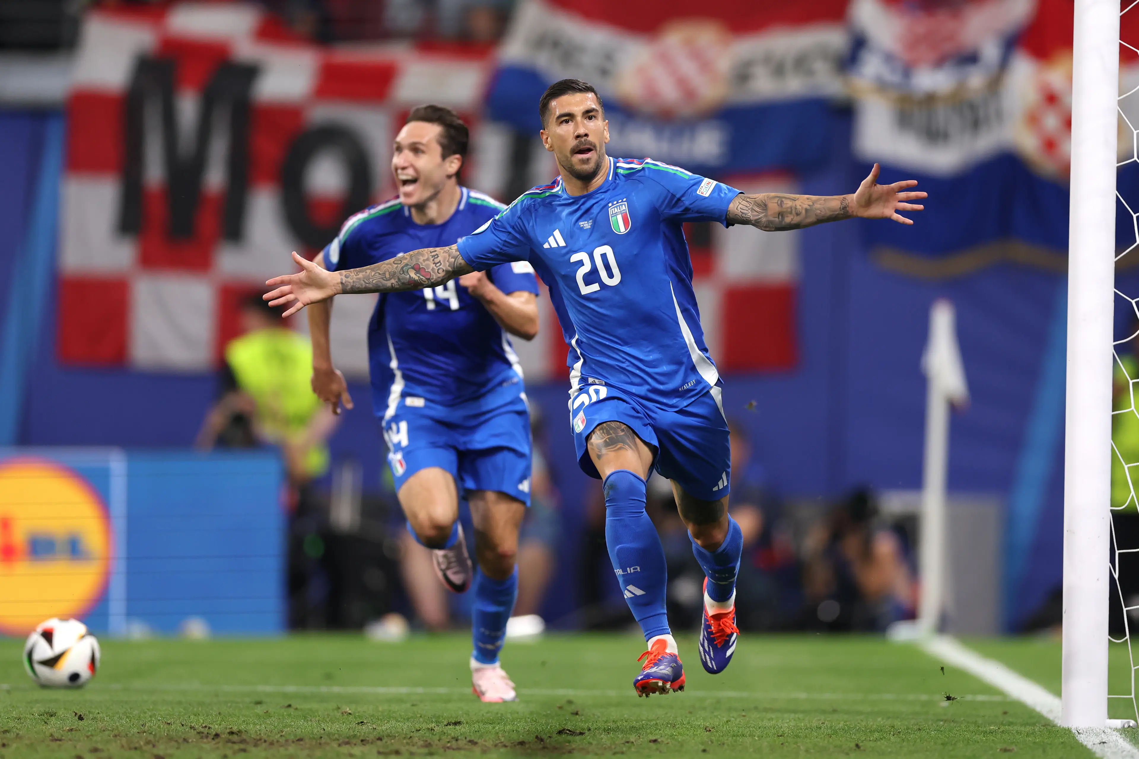 Mattia Zaccagni wheels away in celebration after scoring for Italy. Image: Getty 