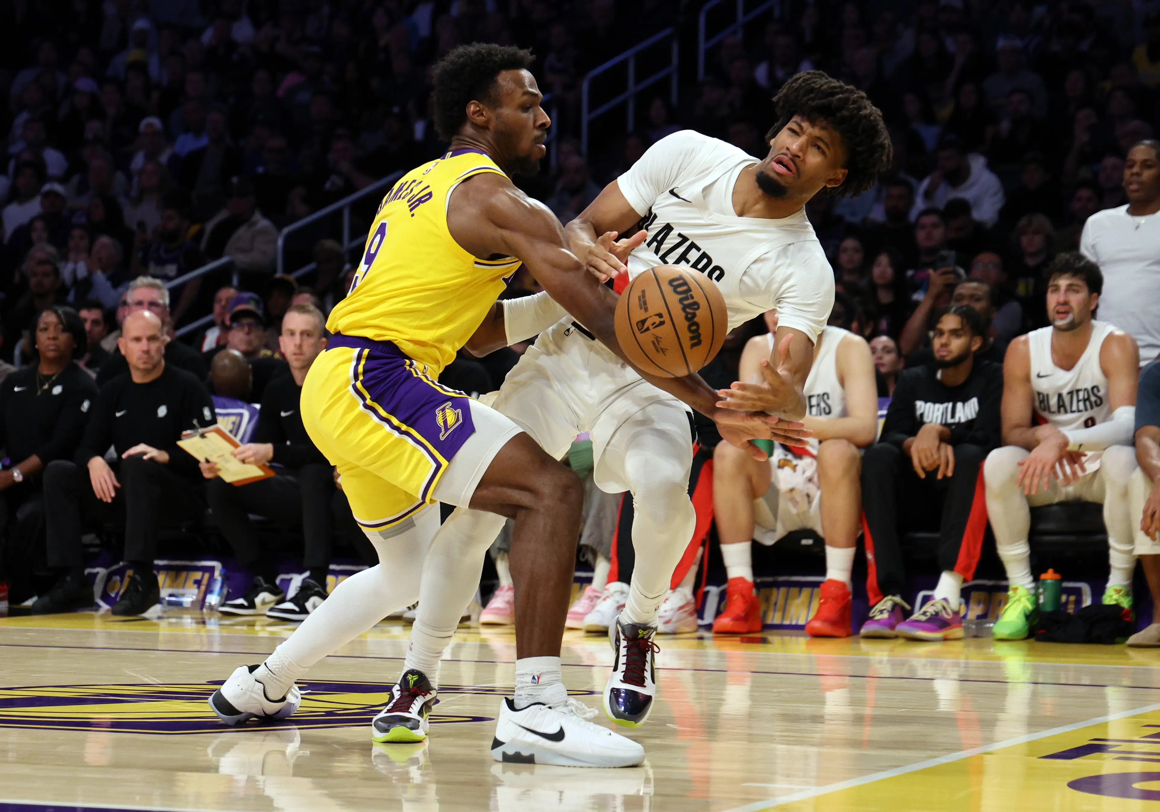 Bronny James steals the ball from Shaedon Sharpe. Image: Getty 
