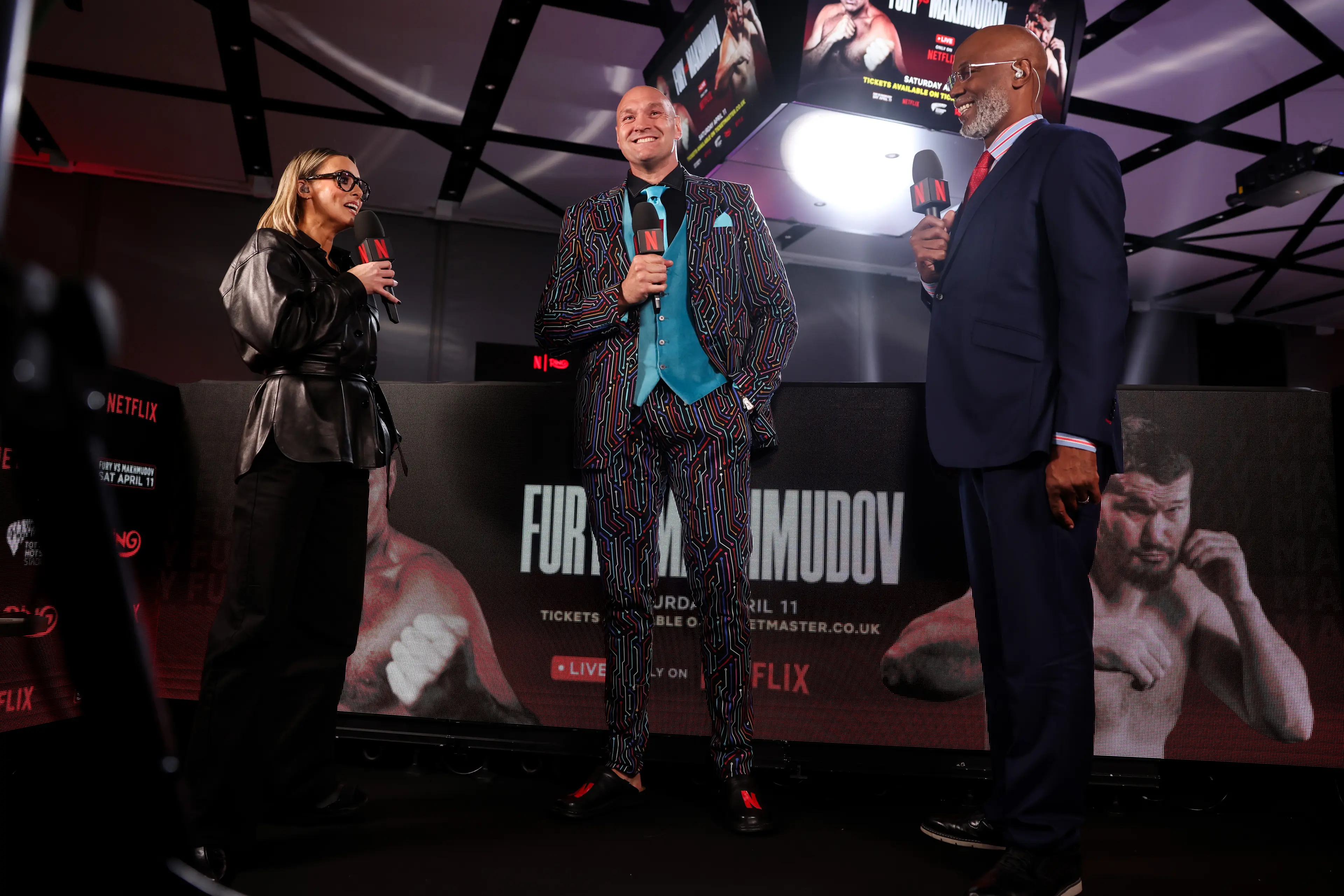Tyson Fury spoke to Anna Woolhouse and Lennox Lewis following the launch presser. Image: Getty 