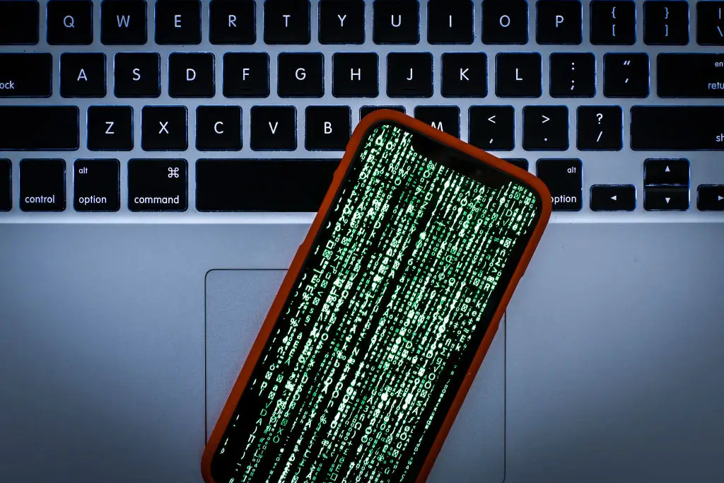 An illustration of an iPhone being hacked (Getty Images)