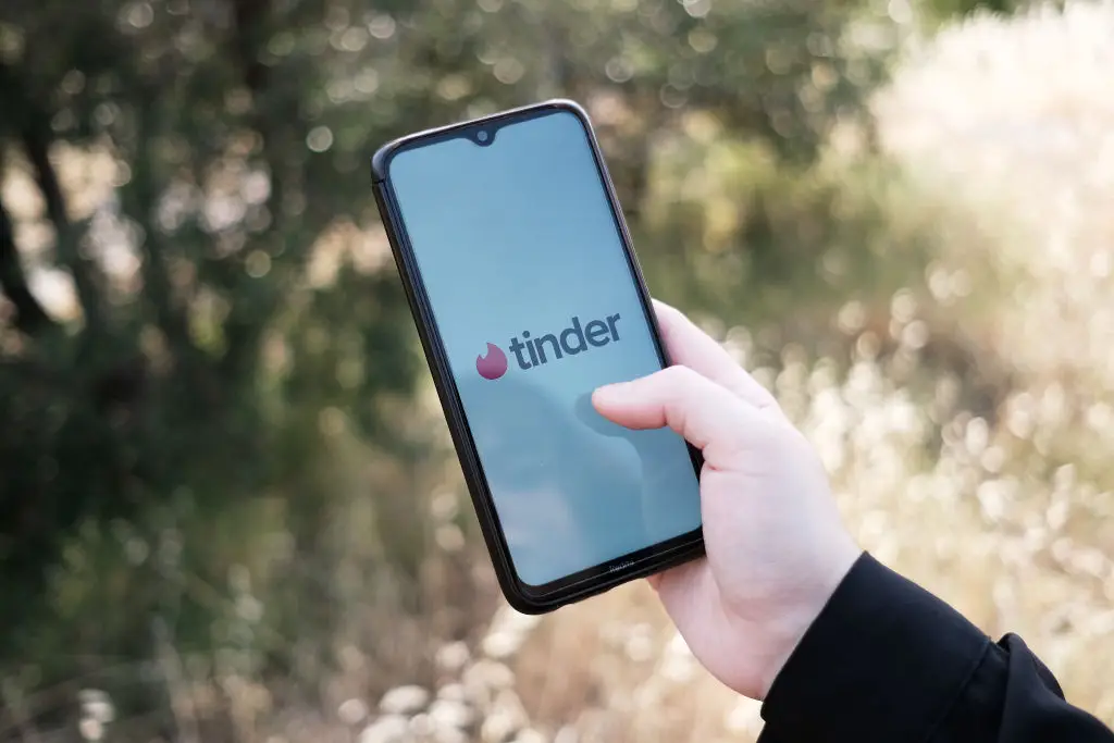 Tinder has added a new feature that scans your photo library using AI to 'analyze your vibe' (Nikolas Kokovlis/NurPhoto via Getty Images)