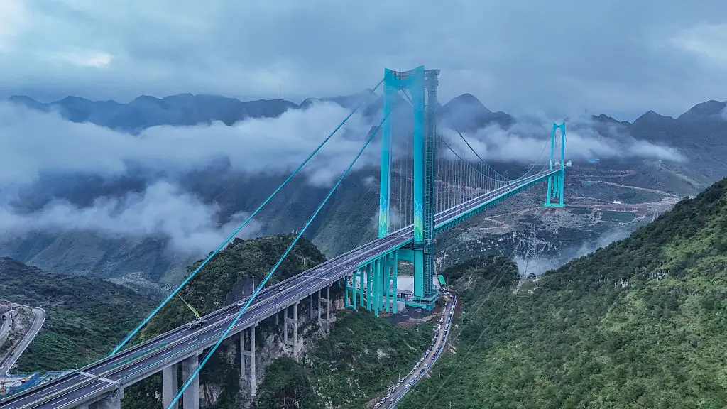 It now takes just two minutes to pass across the Huajiang Canyon as opposed to two hours before (Li Yunfeng/VCG via Getty Images)