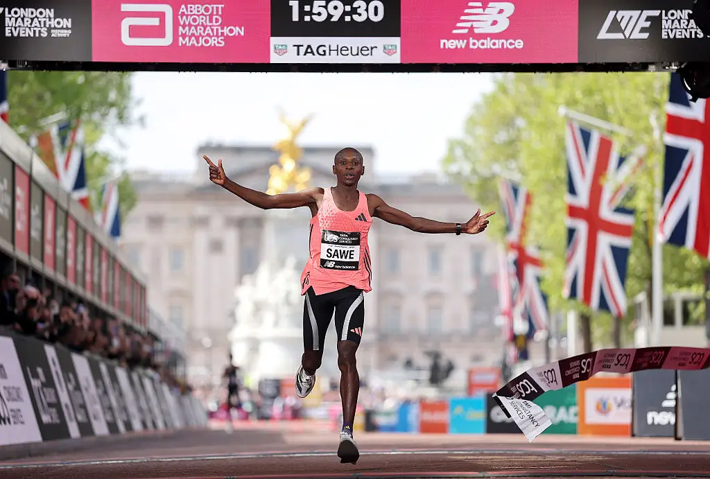 Sabastian Sawe won the London marathon with a record-breaking time, becoming the first to complete the 26.2 miles in under two hours (Alex Davidson/Getty Images)