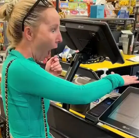 Woman pays for groceries using chip in her hand and people don't know what to think