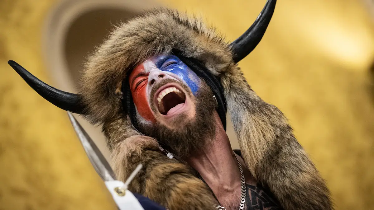 Chansley was a prominent supporter of Q-Anon before his arrest and conviction (Win McNamee / Staff via Getty)