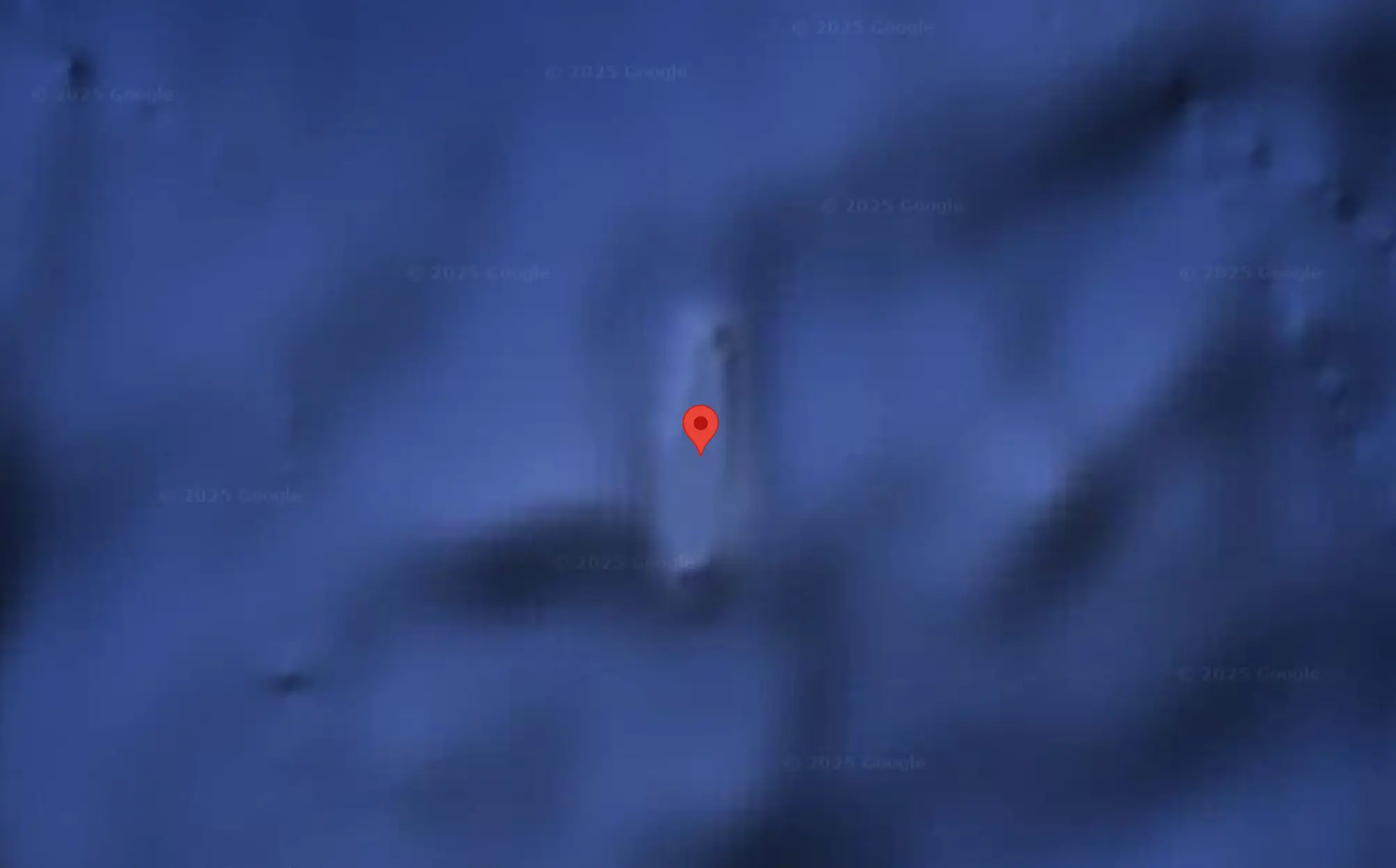 Google Earth still shows a shadowy outline of an island where it was once believed Sandy Island was located (Google)