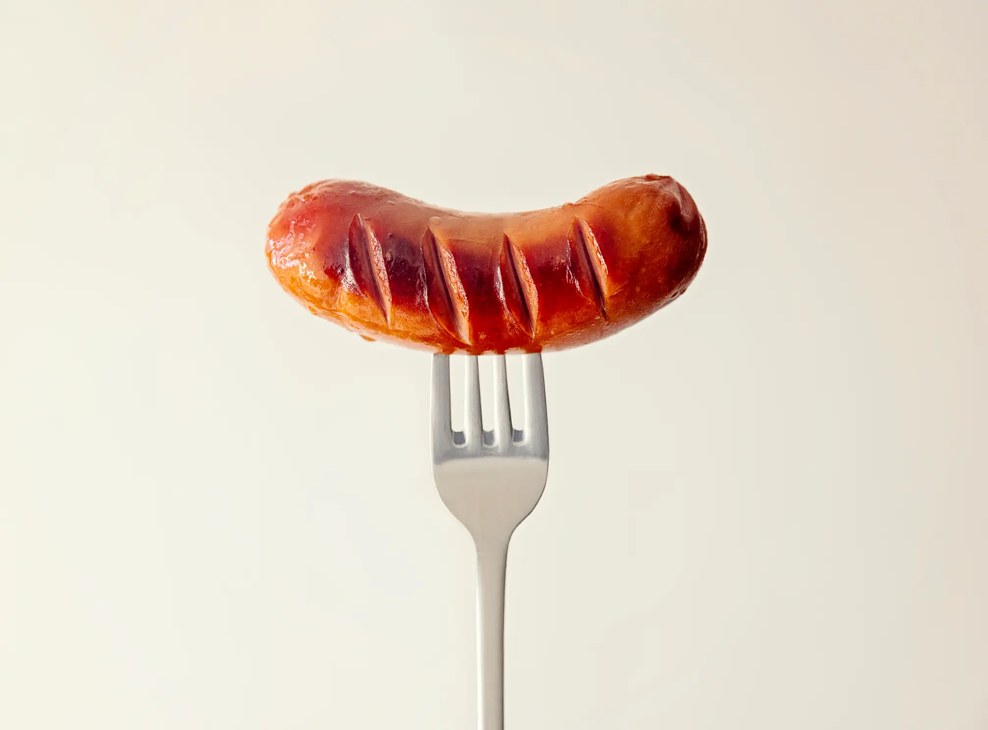 Sausages and other processed meats are identified as a significant health risk by experts (Getty Stock)