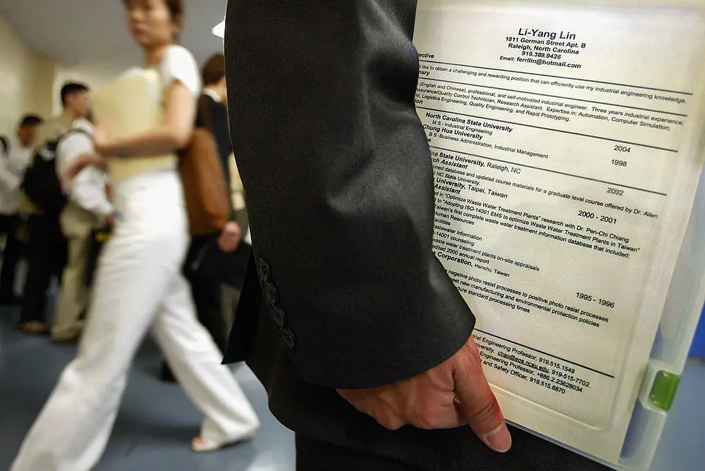 Gone are the days when only humans will read your CV, as many workplaces use AI to filter through hundreds, if not thousands of applications (Spencer Platt/Getty Images)