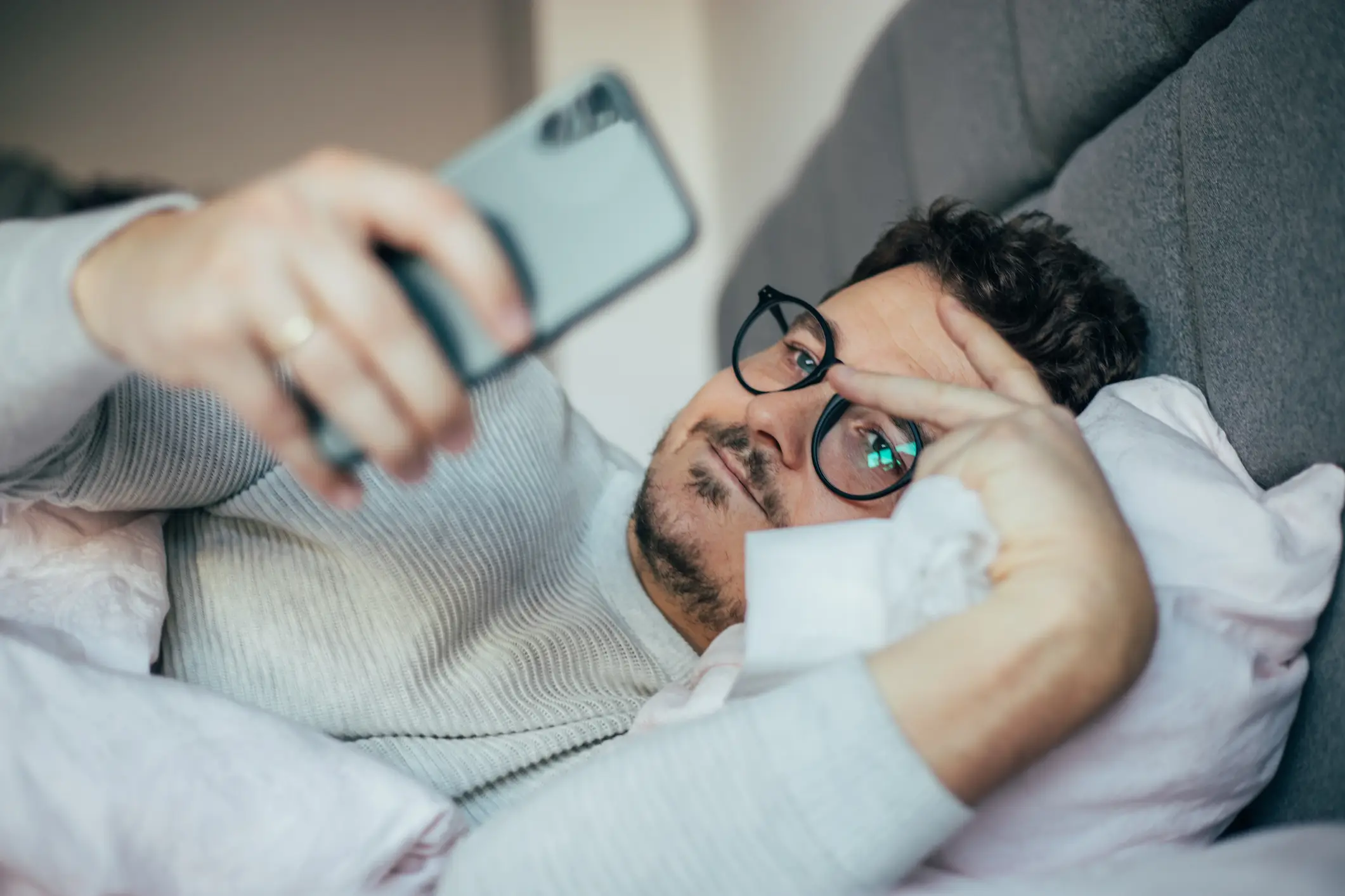 Using your iPhone less and holding it further away can reduce the radiation that your body intakes (Getty Stock)
