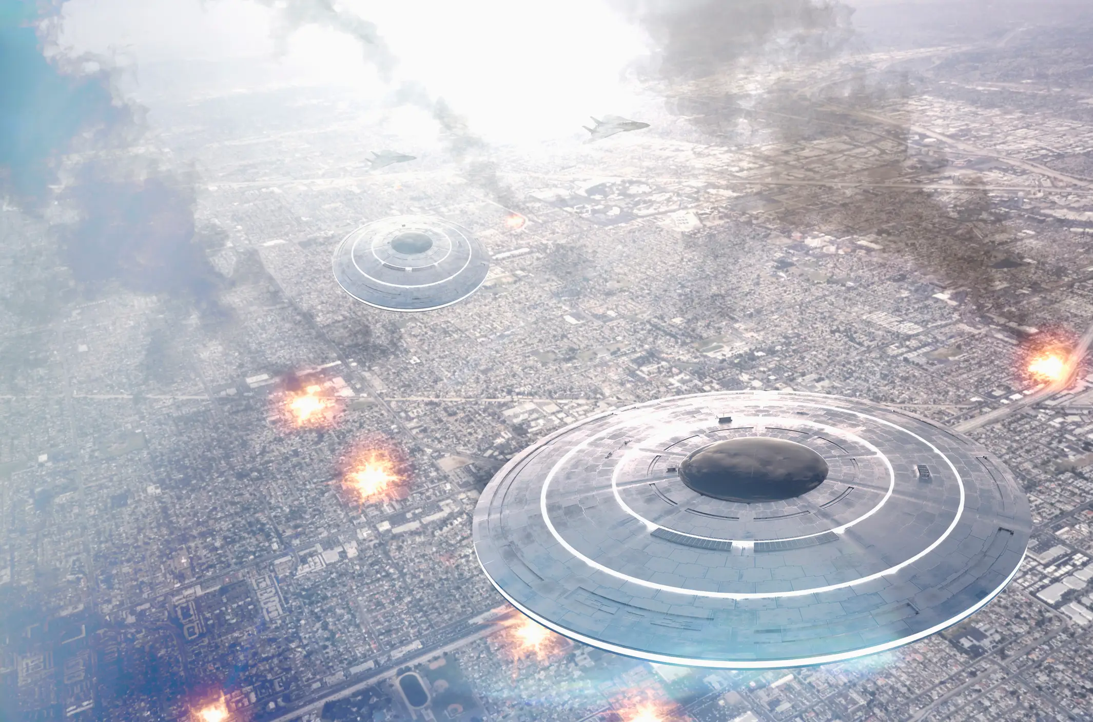 Circular UFOs flying over smoking city (Getty Images)