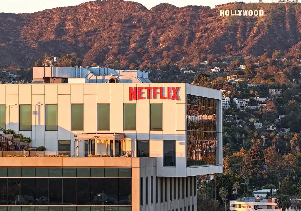Ted Sarandos, Netflix co-CEO, claims that AI tools reduce costs and time for film productions (Mario Tama/Getty Images)