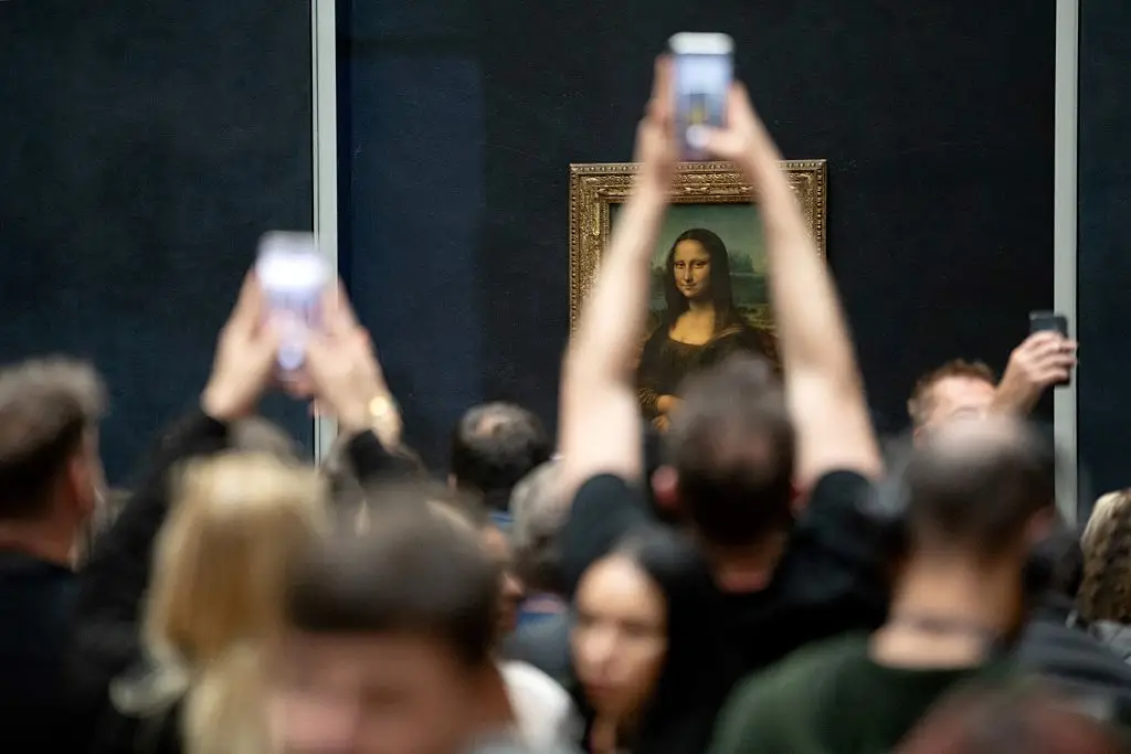 It'll now cost around 45 percent more to take a glimpse at the Mona Lisa and the Louvre's other iconic artworks (Antonin Utz/AFP via Getty Images)