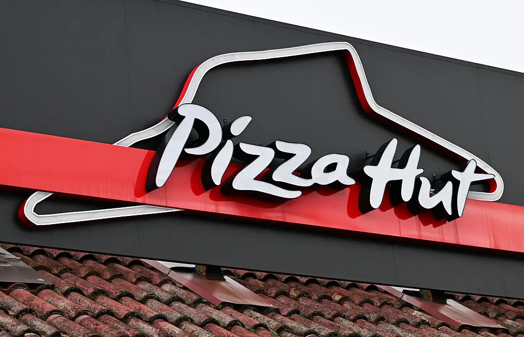 Pizza Hut has found itself at the centre of a $100 million lawsuit over an AI delivery system (NurPhoto/Contributor/Getty)