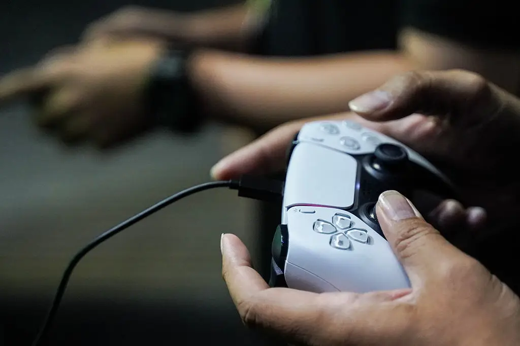 It's always frustrating when your controller's battery dies, as you have to return to the wires of the past (Anusak Laowilas/NurPhoto via Getty Images)