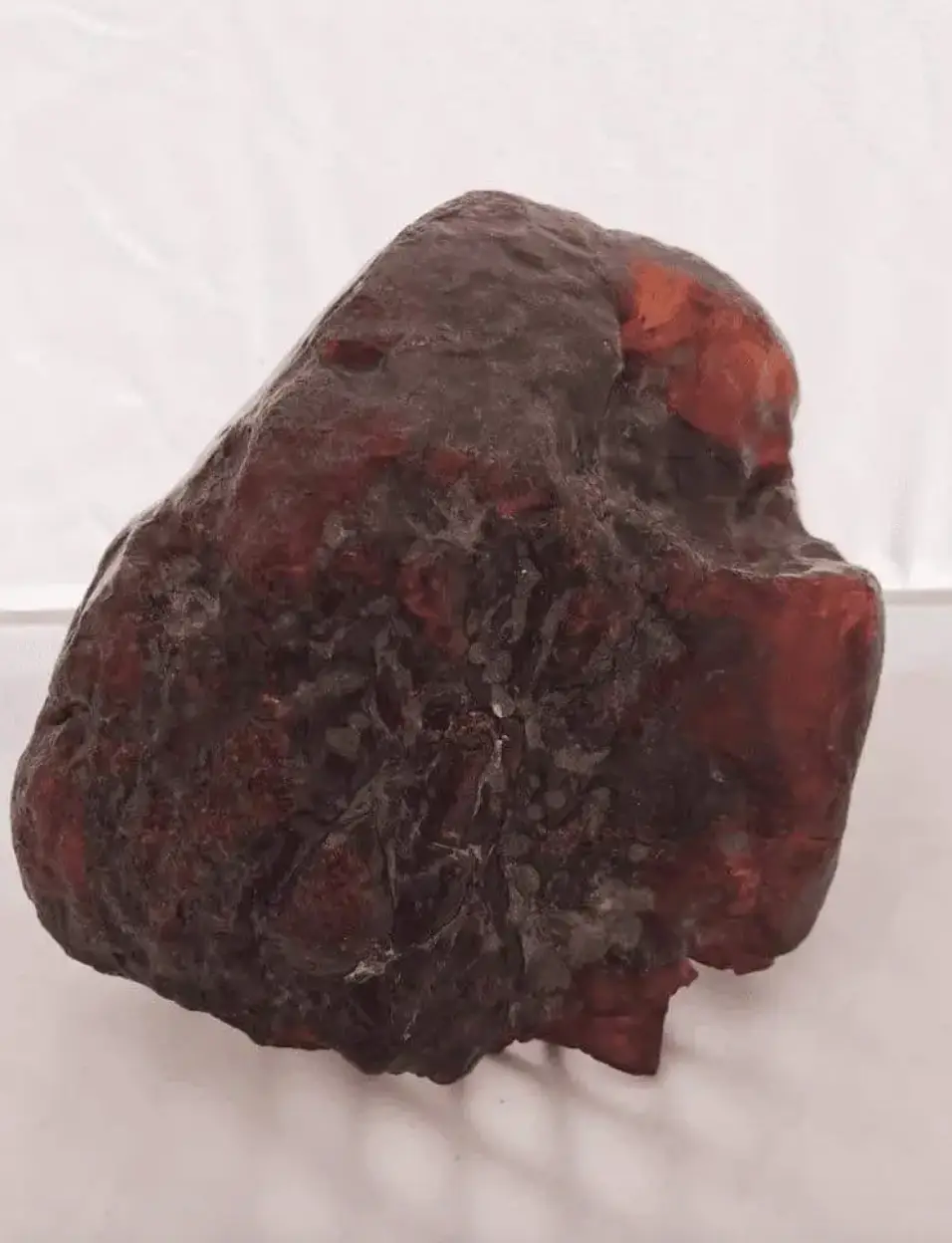 An elderly woman used a 3.3 kg amber nugget as a doorstop for years after finding it on a stream bed (Museo de Buzau/Facebook)