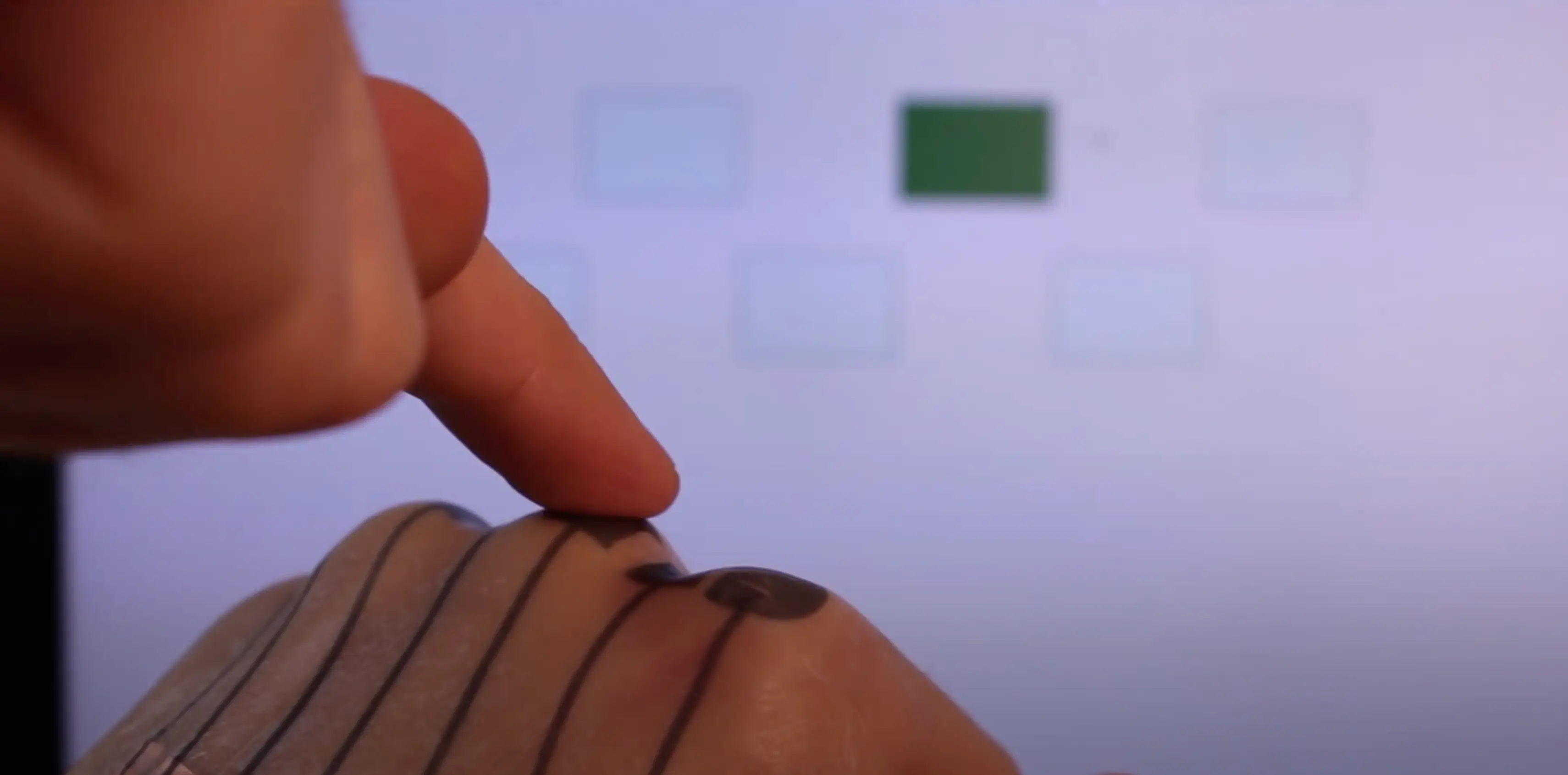 You can trigger the sensors by pressing on the tattoo (YouTube/@EmbodiedInteraction)