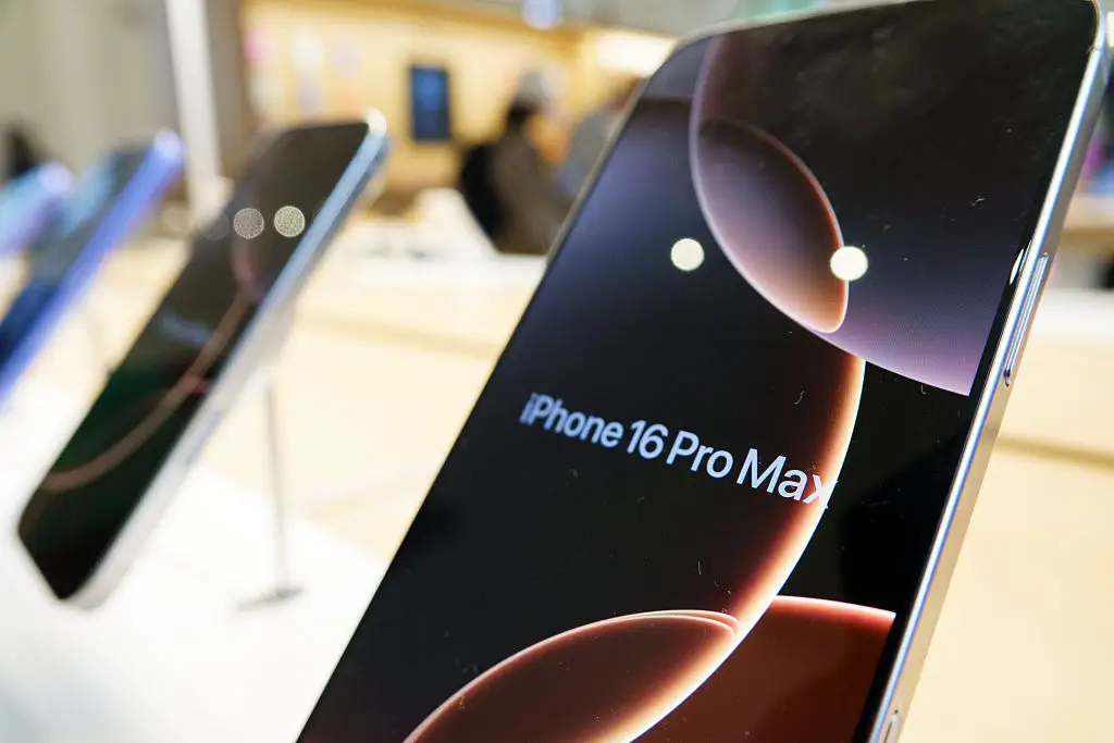 The woman is now conducting the experiment with a third iPhone model (Kevin Carter/Getty Images)