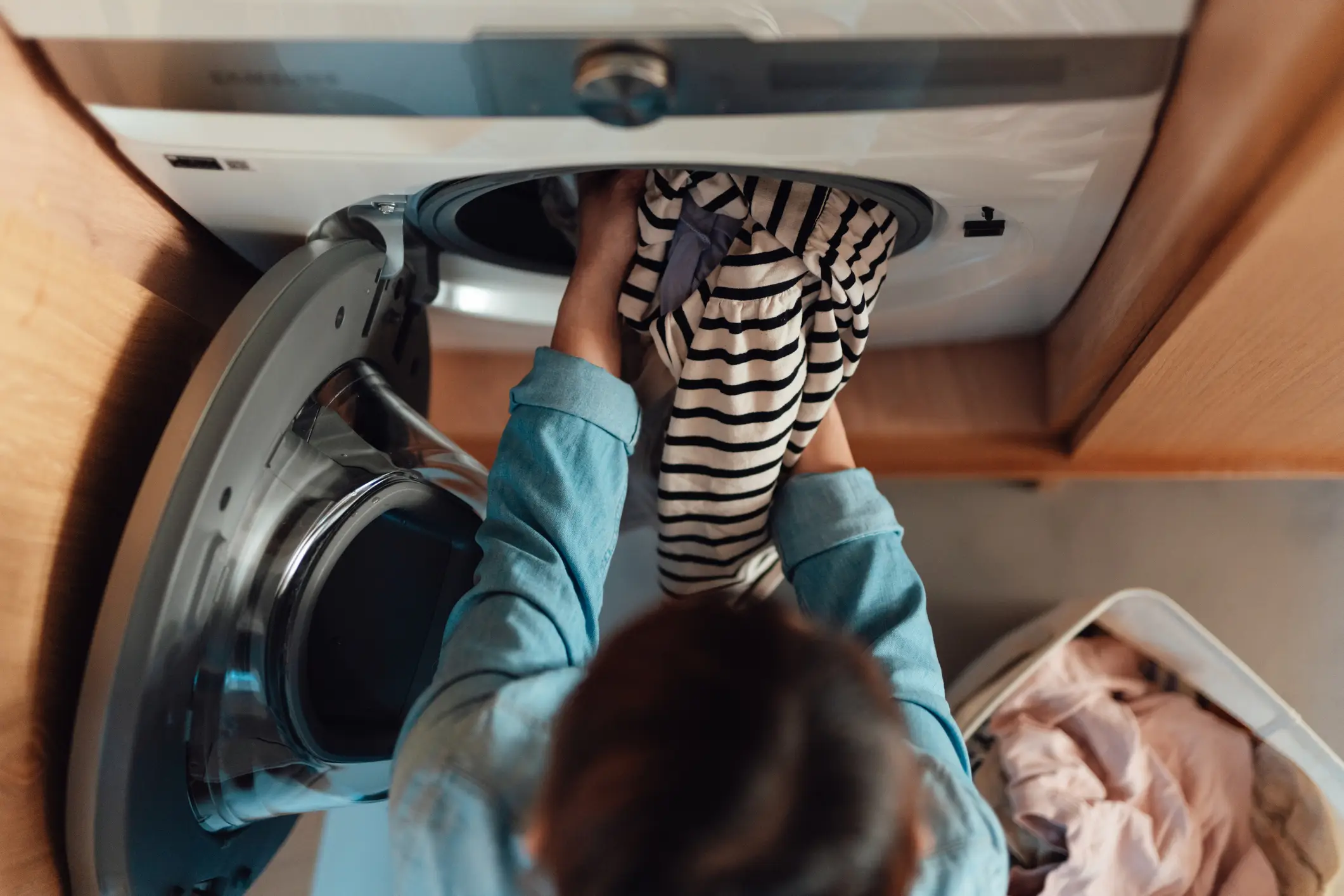 Shutting the washing machine door can create ideal conditions for mould (Oscar Wong/Getty)