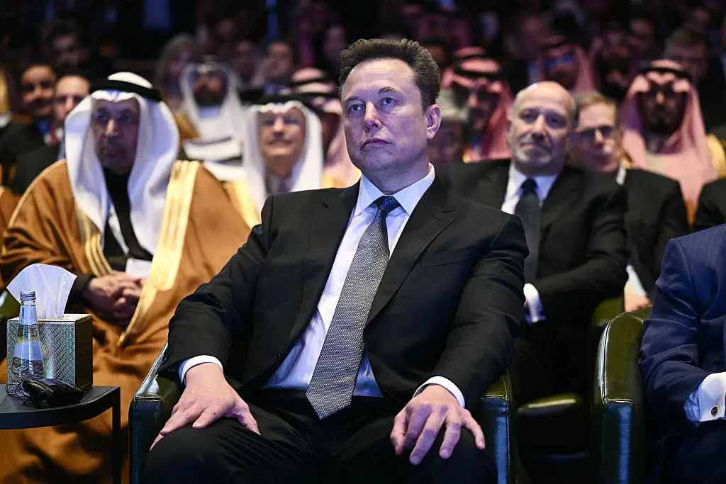 Musk and Anonymous have been at each other's throats again. (BRENDAN SMIALOWSKI/Contributor/Getty)