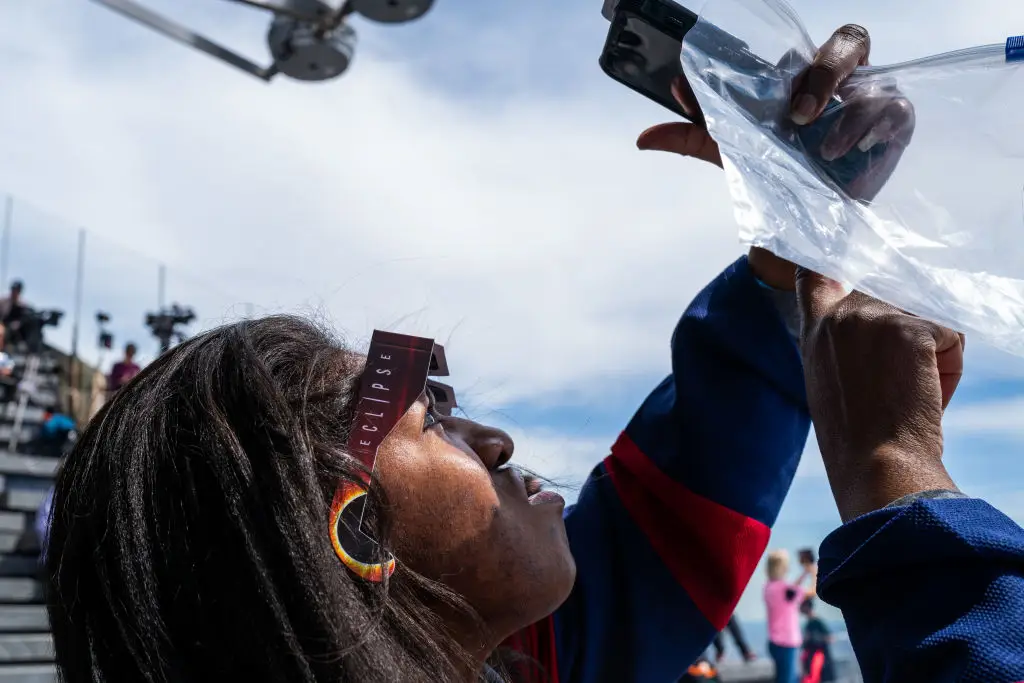 You also need to protect your phone or camera when taking pictures of the solar eclipse (Spencer Platt/Getty Images)