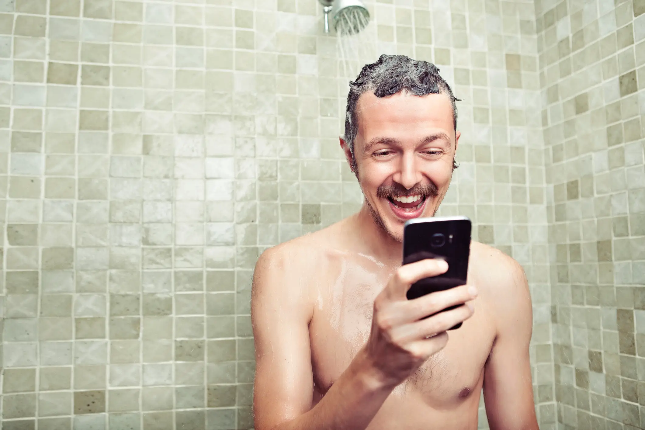 Heat from showering with your phone is far more likely to damage it than any water contact (Getty Stock)