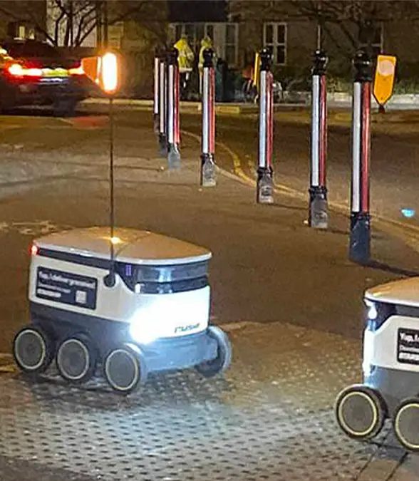 Two delivery bots were caught in a comical encounter / James Harman / Facebook