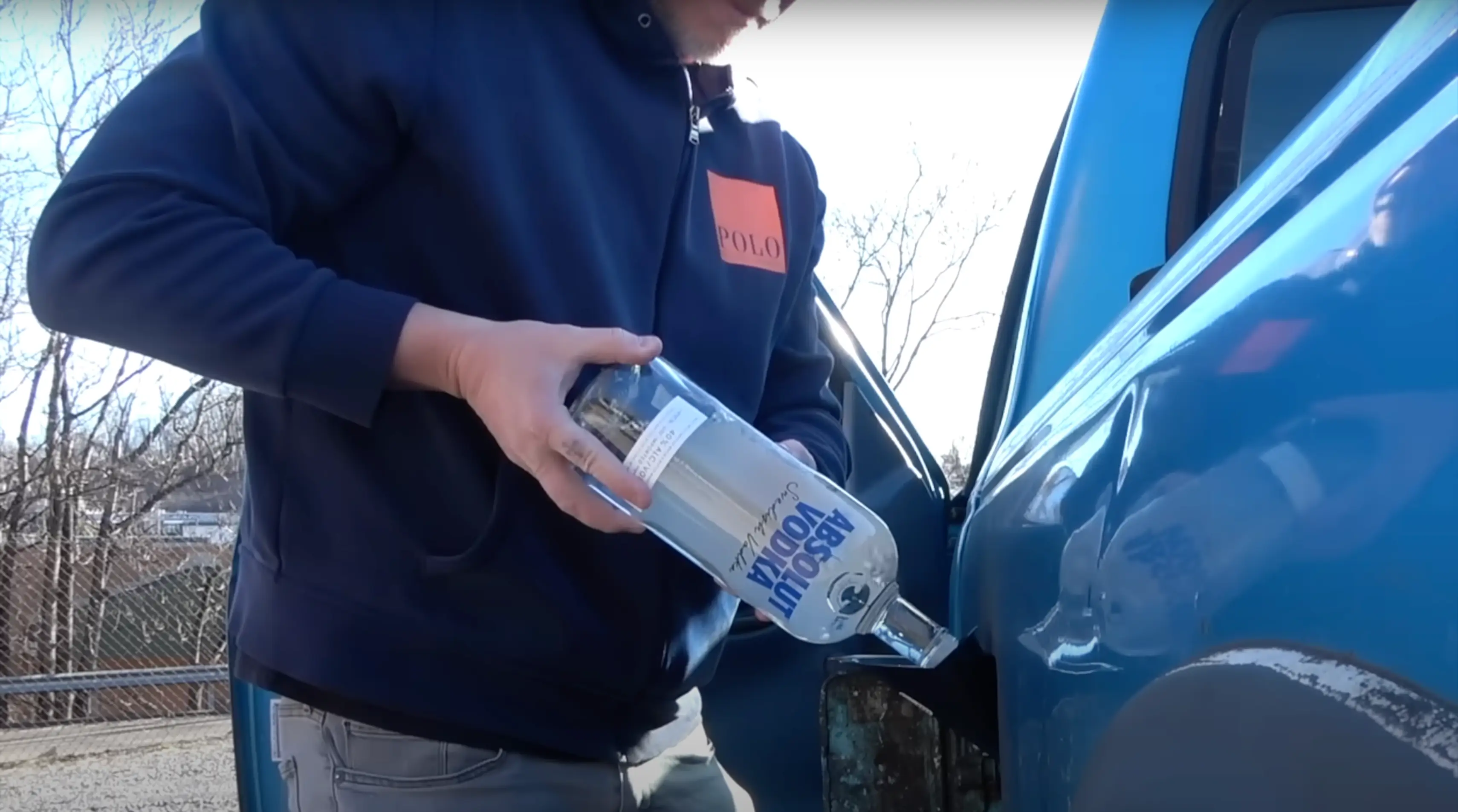The YouTuber filled up his gas tank with vodka (YouTube/@AutoVlogOfficial)
