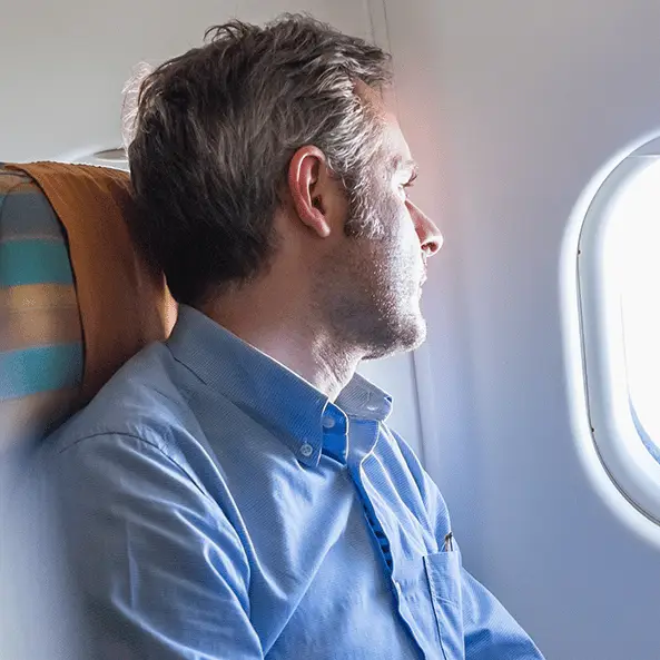 Passenger claims he spent 7-hour flight with exposed bolt digging into his head because seat had no headrest