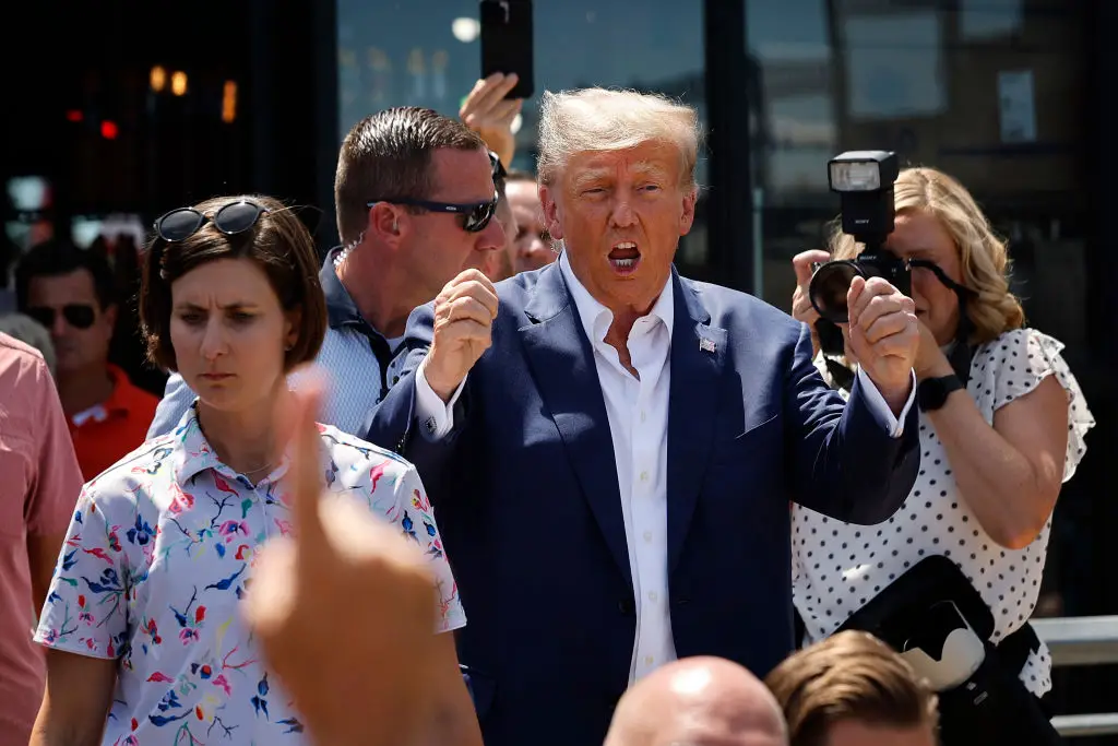 A new settlement with the Department of Justice sees Trump and his sons granted immunity from existing tax audits (Chip Somodevilla/Getty Images)