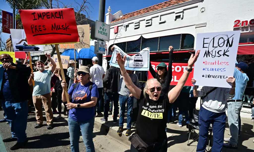Musk's involvement in the Trump administration is likely the primary motivation behind protests and attacks on Tesla showrooms (Frederic J. Brown/AFP via Getty Images)