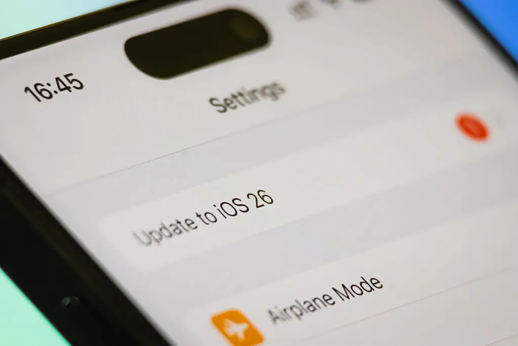 The upgrade to iOS 26 has left many feeling frustrated, especially with its new visual design (Cheng Xin/Getty Images)