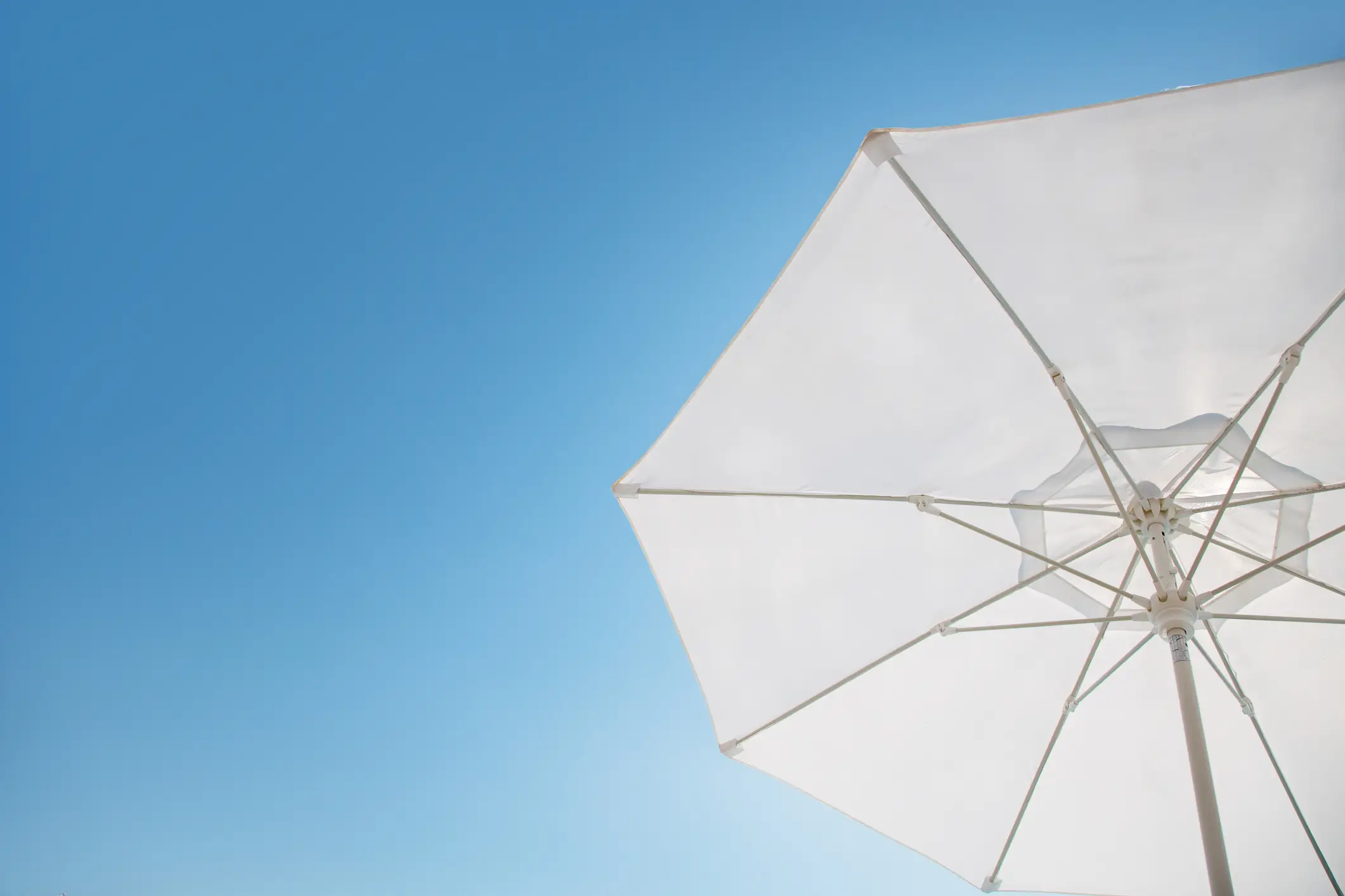 An umbrella might actually be the best accessory to use if you're looking to preserve your youthful looks (Getty Stock)