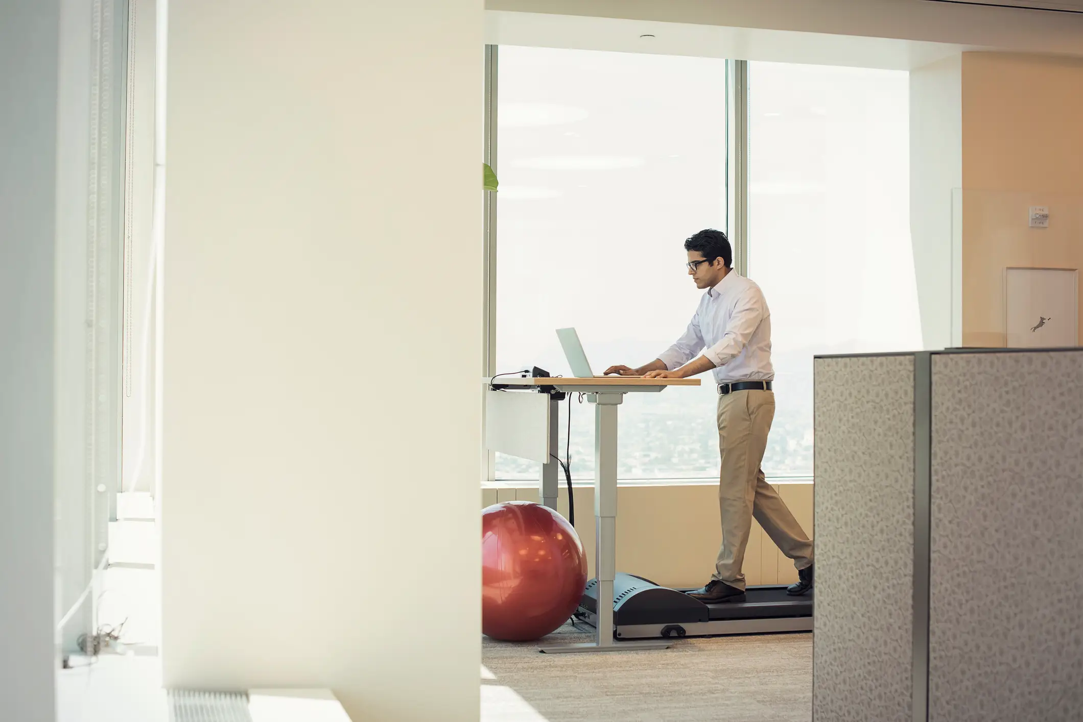 Getting a treadmill underneath a standing desk will make a world of a difference compared to being sat down all day (Getty Stock)