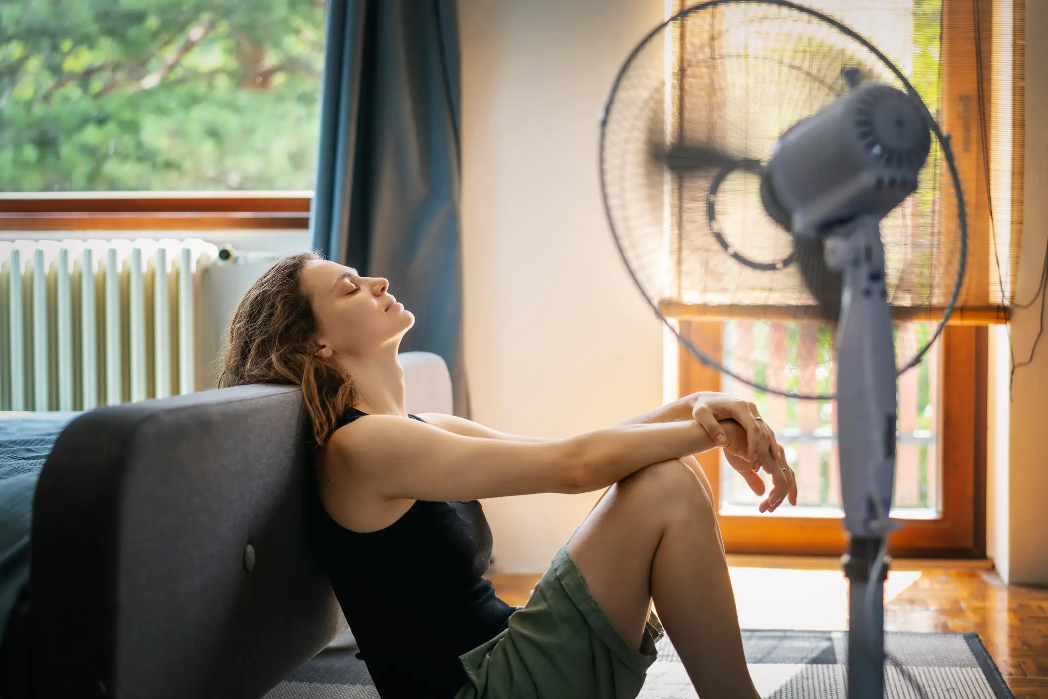 Using a fan can help push hot air out and draw cooler air in (Olezzo/Getty)