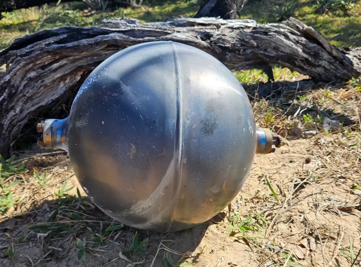 Experts predict that the orbs originated from a rocket launch, with debris like this often found years after it fell from the sky (Facebook/Queensland Fire Department)
