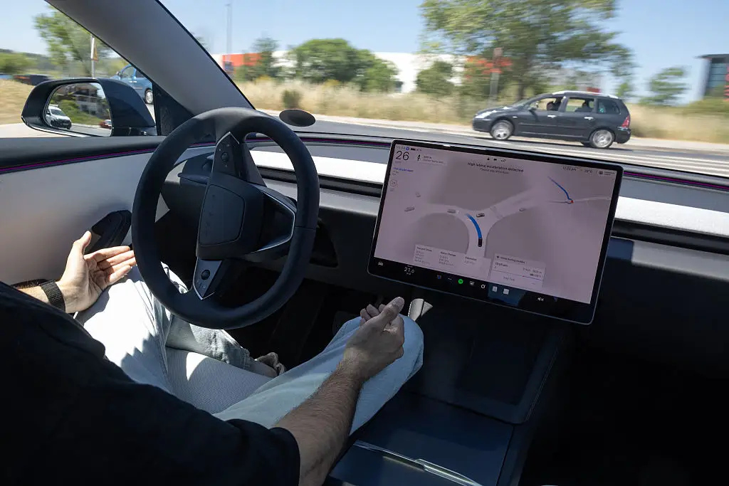 Elluswamy, Tesla's head of AI, claims that Butler overrode the FSD control and fully pressed on the accelerator himself (Josep Lago/AFP via Getty Images)