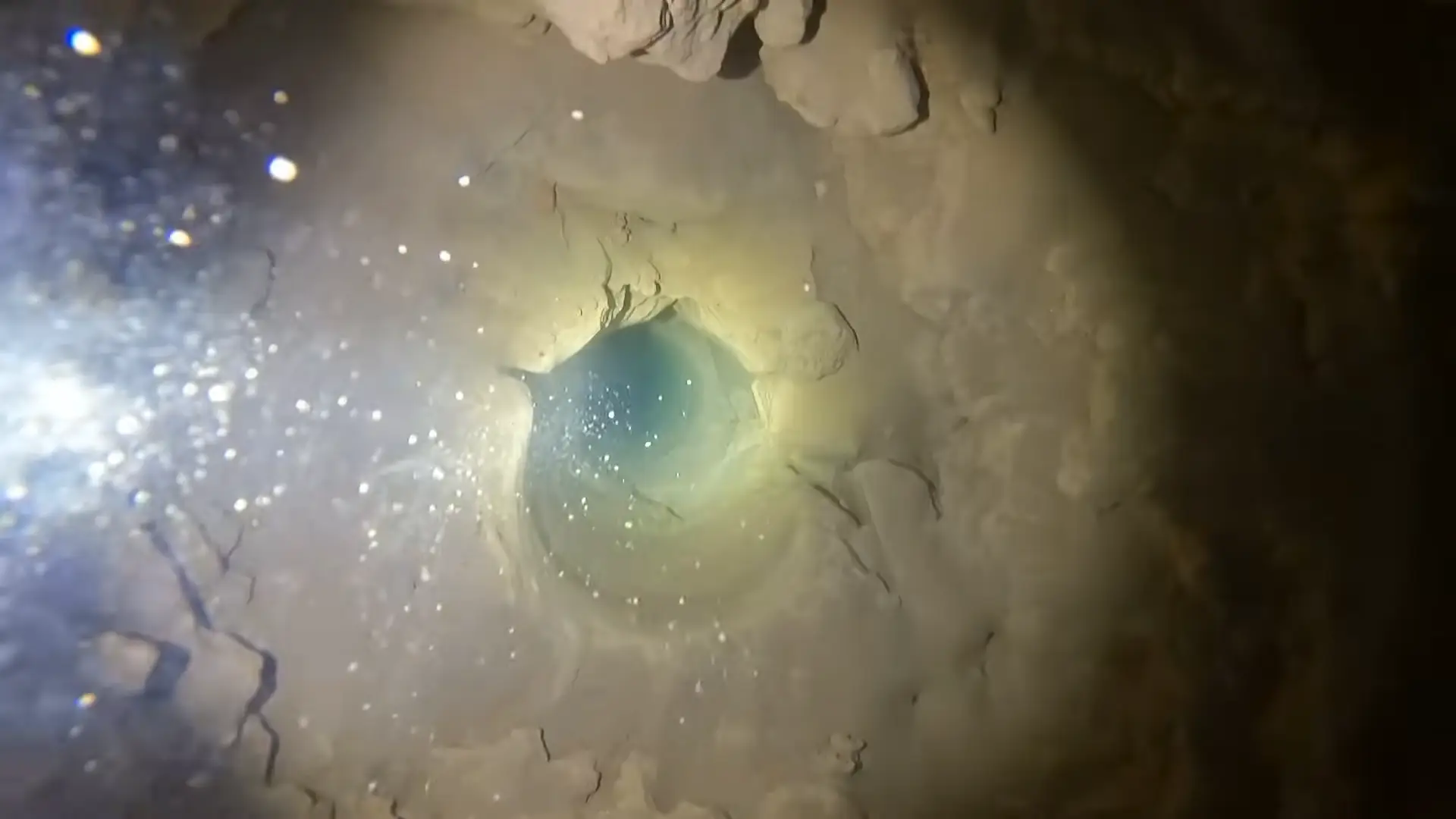 At the bottom you're greeted with the eerie darkness of groundwater (YouTube/Andy Wende)