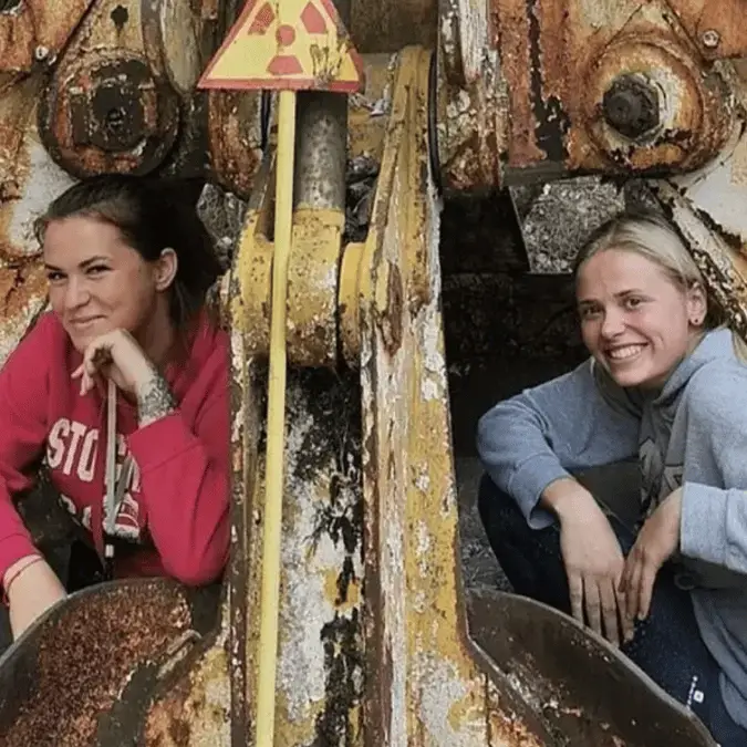 Chilling story behind image of two women sitting on 'the most radioactive thing in Chernobyl'