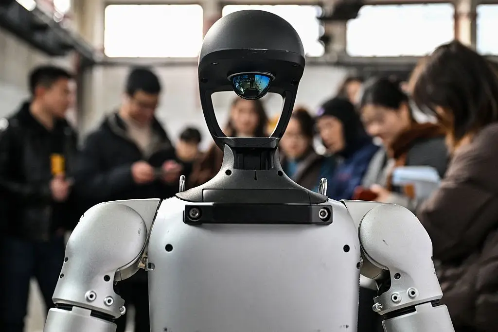 Humanoid robots are being trained on potentially millions of hours of human behavioral data in order to prepare for the workplace (Hector Retamal/AFP via Getty Images)