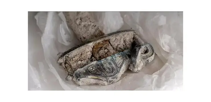 Pictured here is the gilded silver handle of the sword (BBC/Rare TV)