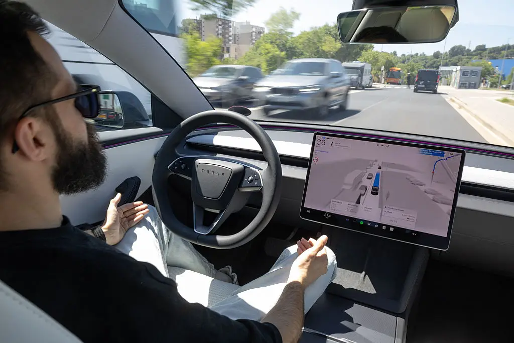 Tesla vehicles using FSD can technically operate independently, but the company mandates that drivers remain ready to take control at all times (Josep Lago/AFP via Getty Images)