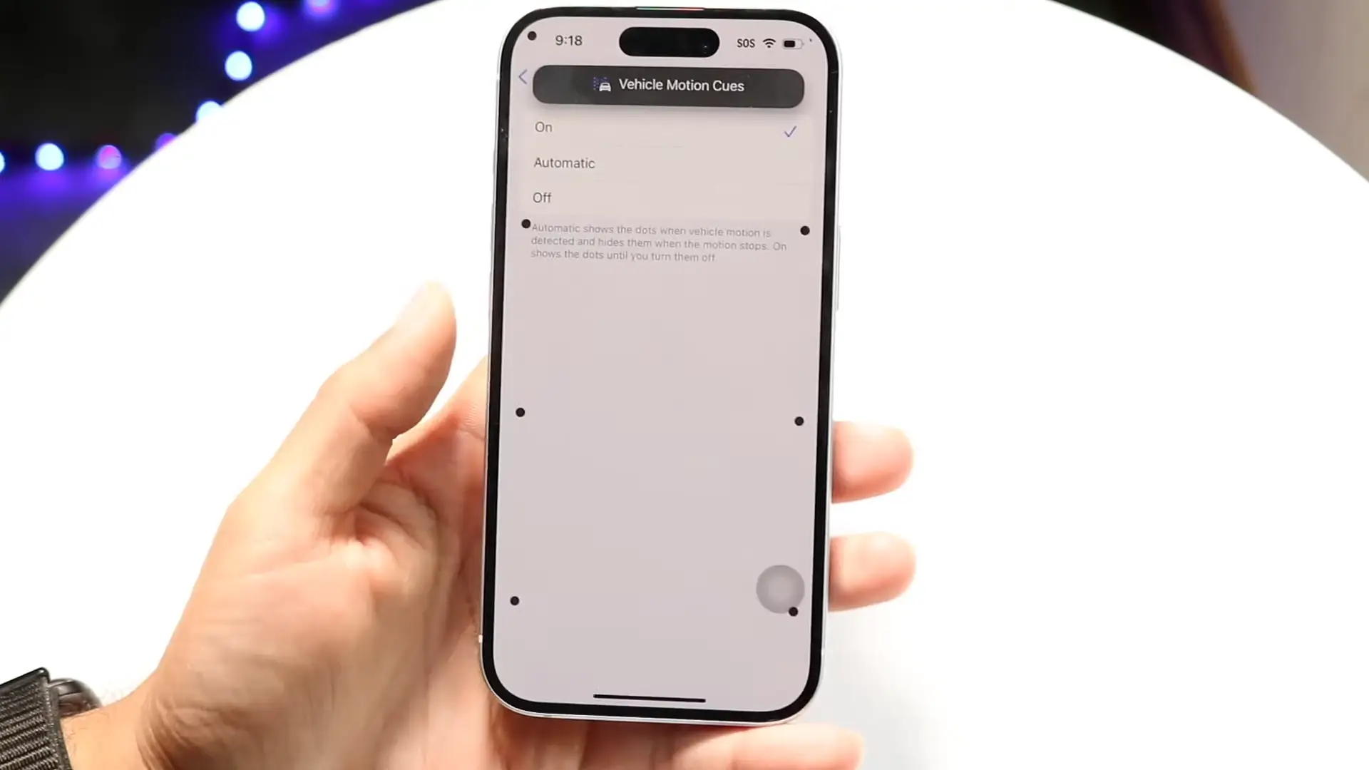 Turning on Vehicle Motion Cues puts dynamic dots around your iPhone screen that respond to the movement of a car (YouTube/LoFi Alpaca)