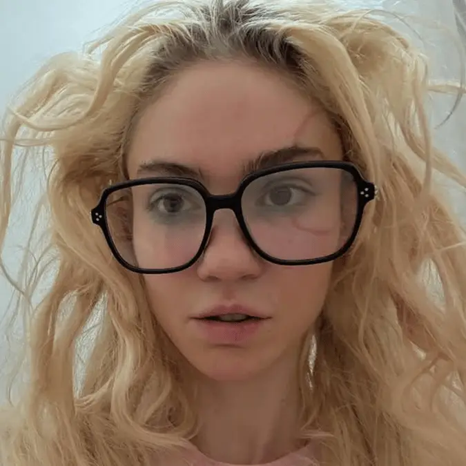 Elon Musk's ex Grimes reveals controversial face tattoo she spent 10 years 'emotionally' working up to