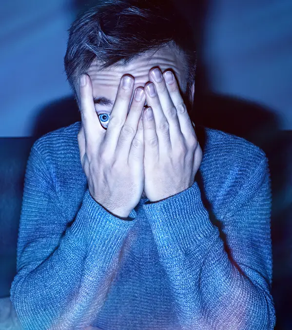 Watching one horror movie can burn up around 150 calories / photoschmidt / Getty