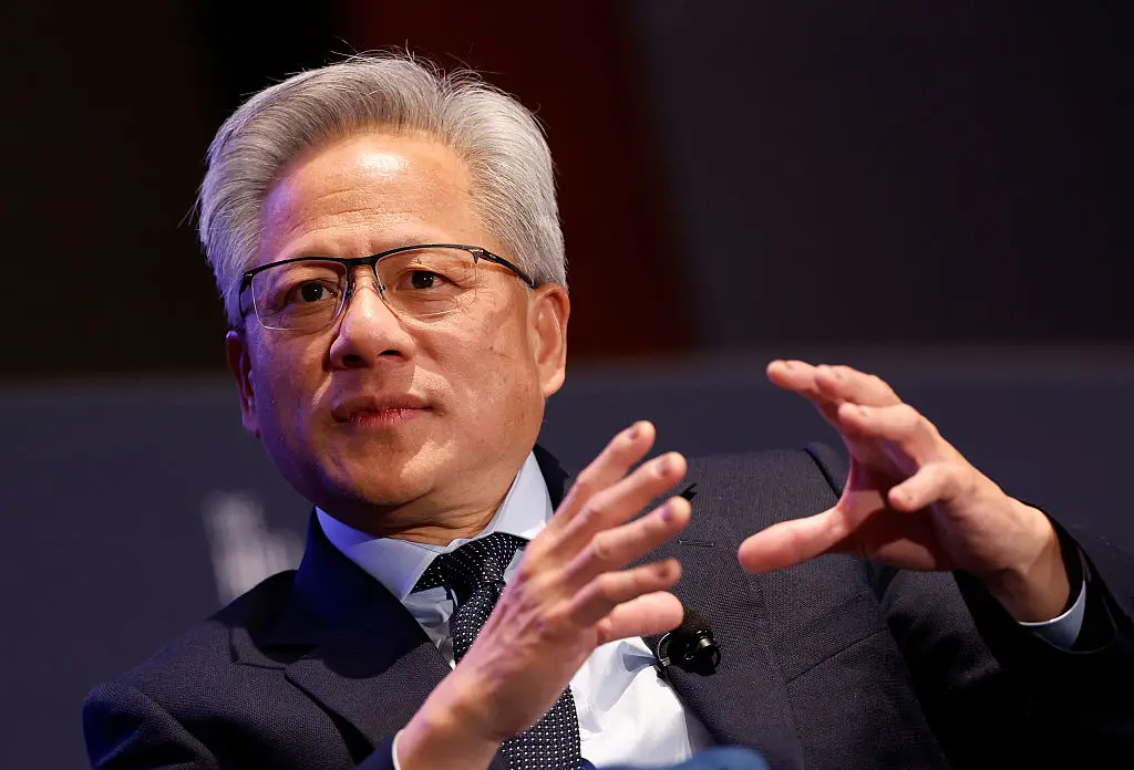Jensen Huang dismisses claims that AI is causing job losses, arguing that anyone mastering AI is the bigger 'threat' (Kevin Dietsch/Getty Images)